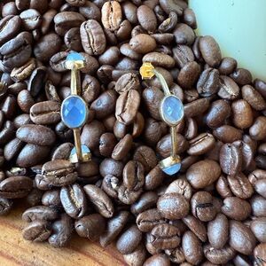 Julie Vos gold hoop earrings with light blue gem stones